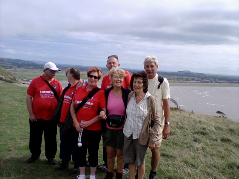 Ernest, Phyllis, Andrew, Jean, Phillip, Aileen, Eileen, Spud on top of Brean Down with Brean Sands in the background